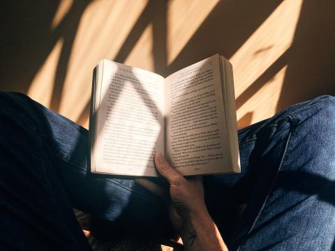 a person holding an open book